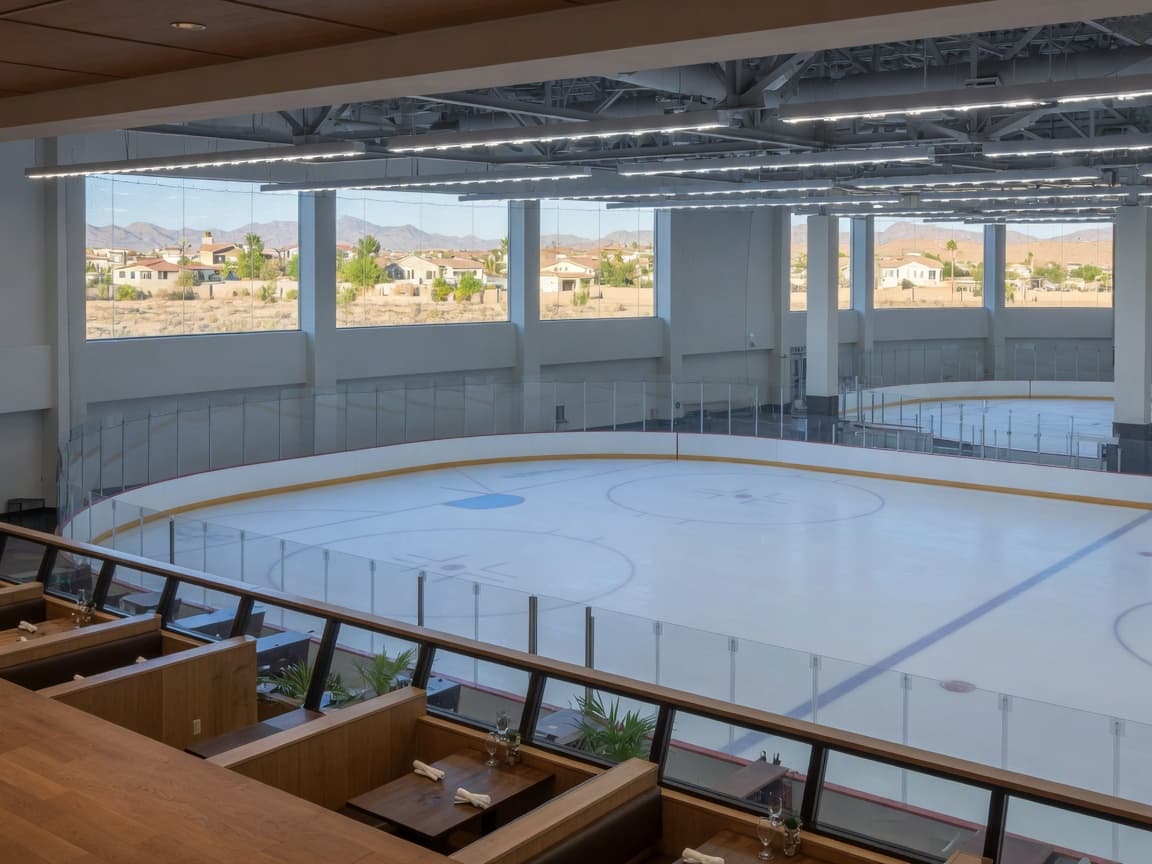 City National Arena ice with desert houses visible through the windows.
